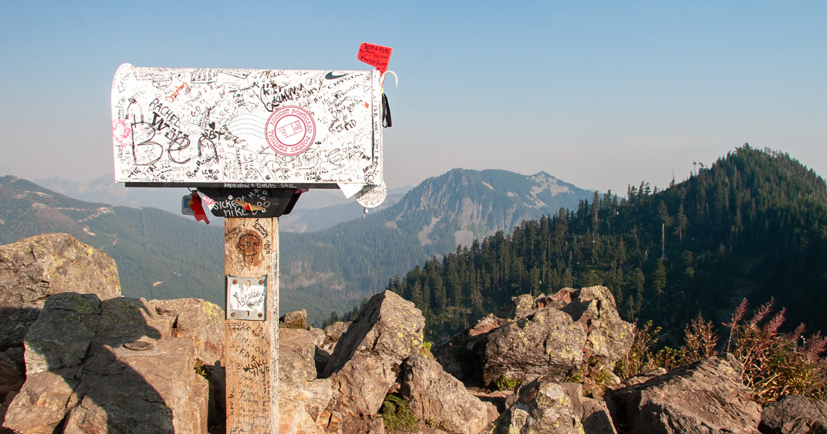 graffiti on mailbox on top of mountain